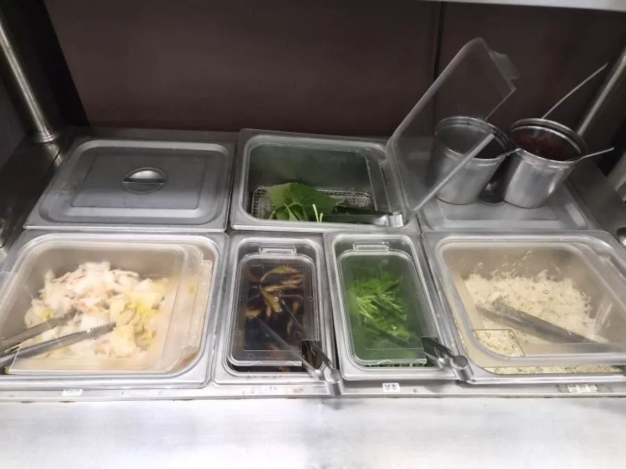 Self-serve bar with baek-kimchi and salad