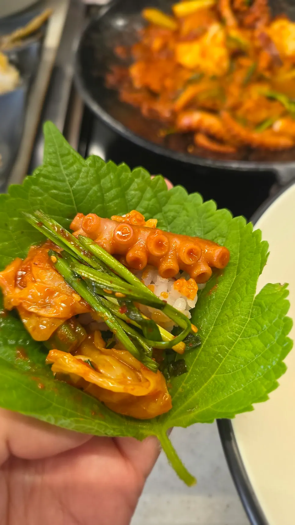 Chive-octopus stir-fry wrapped in perilla leaf