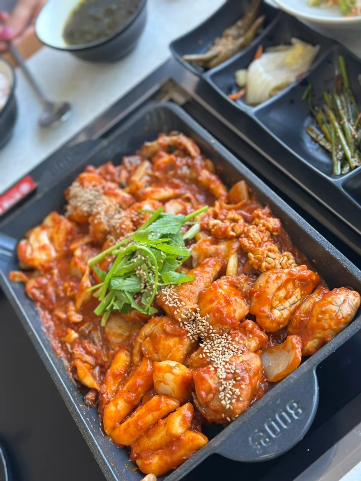 Boneless angler fish stew on a tabletop burner