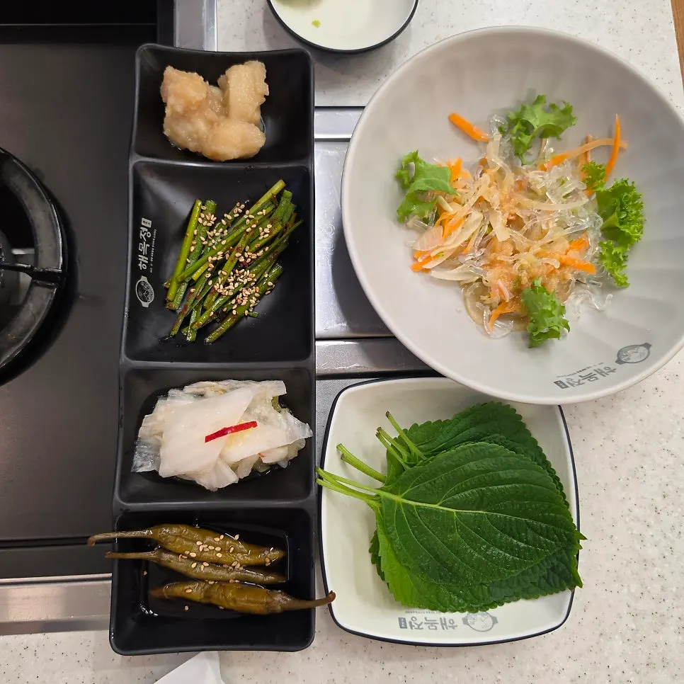 Side dishes at Haemokjeong Guwol Branch including seasoned chives and cold salad