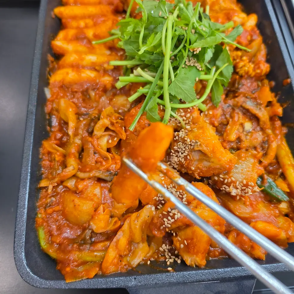 Close-up of boneless monkfish stew with rice cakes