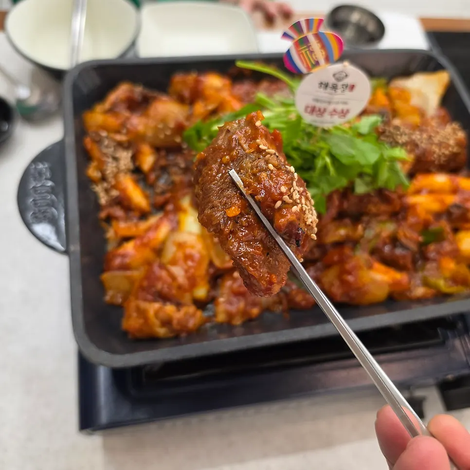 A single piece of pork rib well coated in sauce