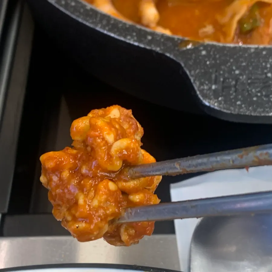 Pot with remaining sauce and seafood