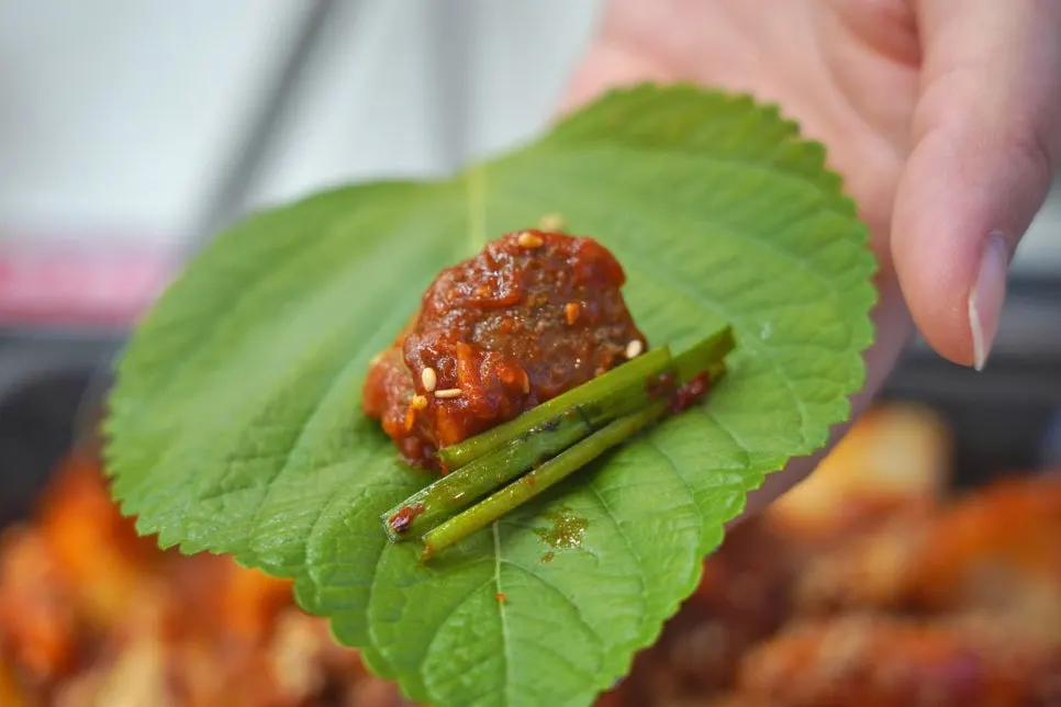 Vinegared red pepper paste and soy sauce served with seafood stew