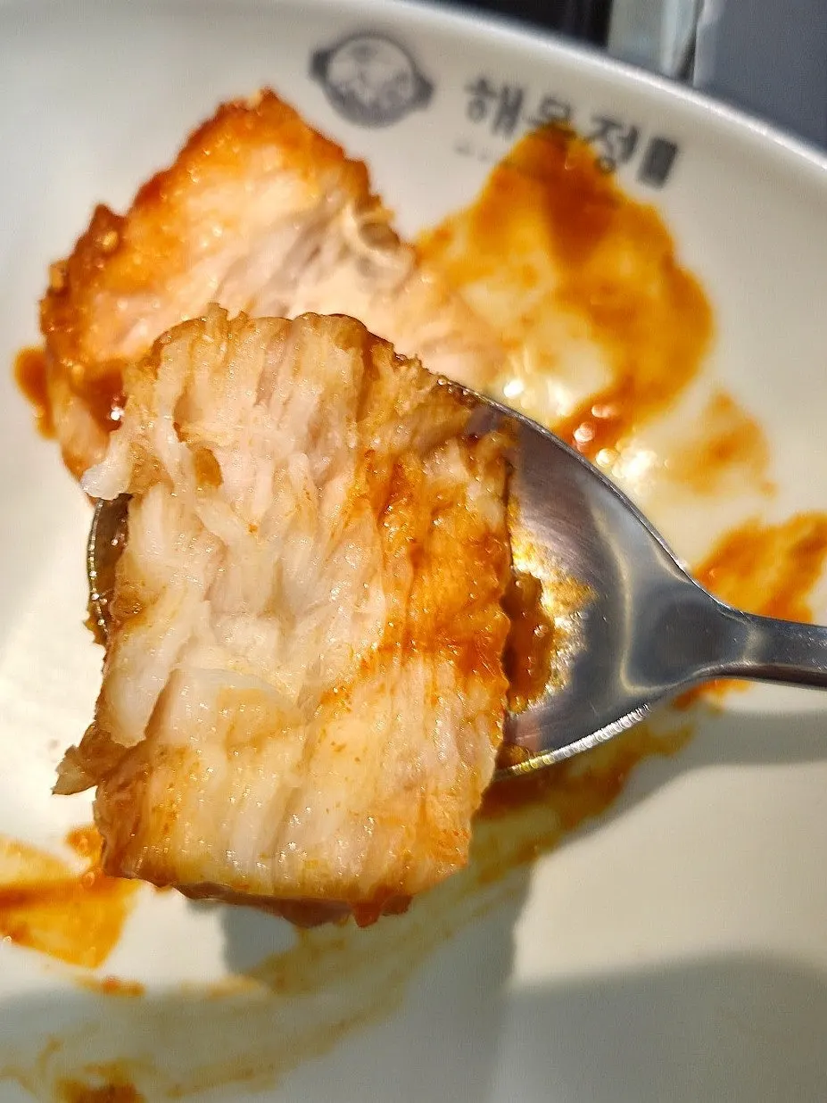 Boneless angler fish stew topped with minari and rice cakes
