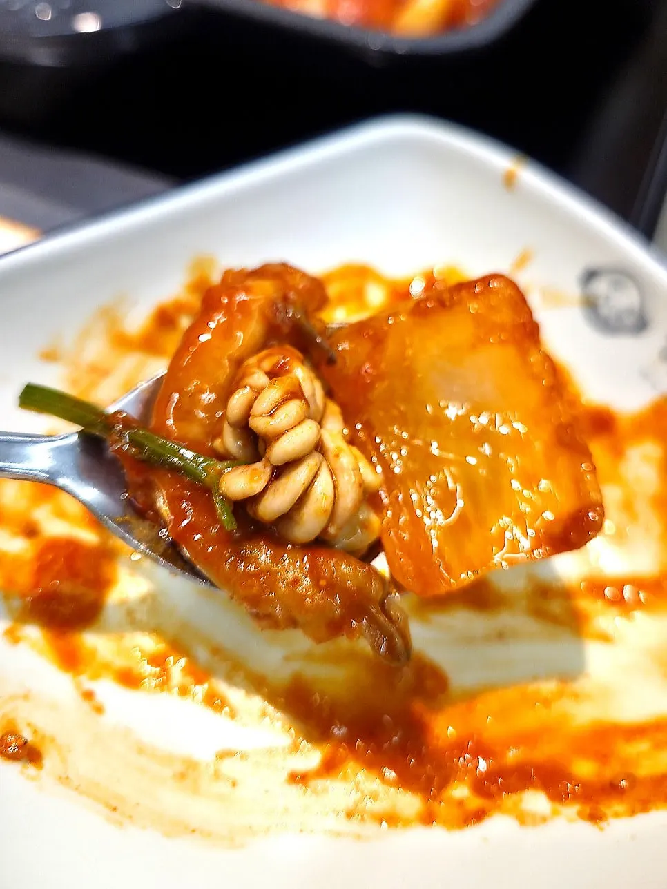 Boneless angler fish stew served in a small plate