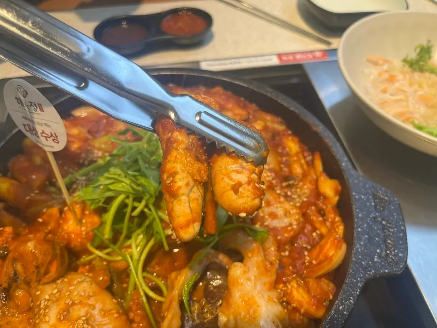 Seafood galbijjim with gonads, rice cake sticks, and water dropwort