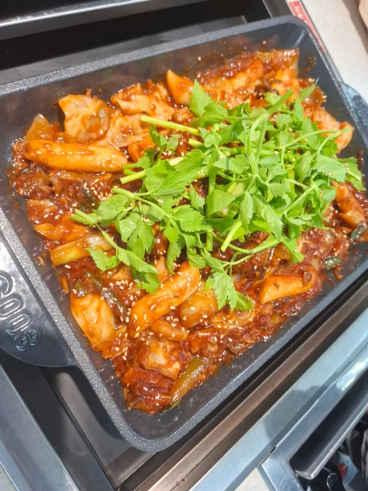 Spicy galbijjim topped with minari at Haemokjeong Seoknam