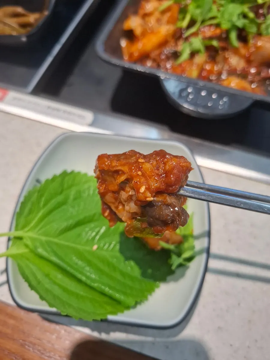 Close-up of galbijjim soaked in spicy sauce