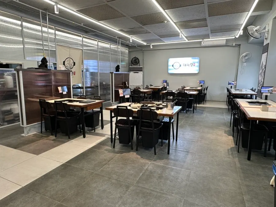 Dining hall with generous table spacing at Haemokjeong Seoknam
