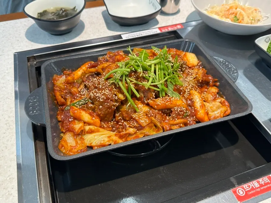 Table with the ordered spicy braised pork ribs placed on it