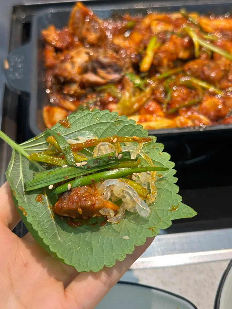 Close-up of the deeply seasoned spicy braised pork ribs