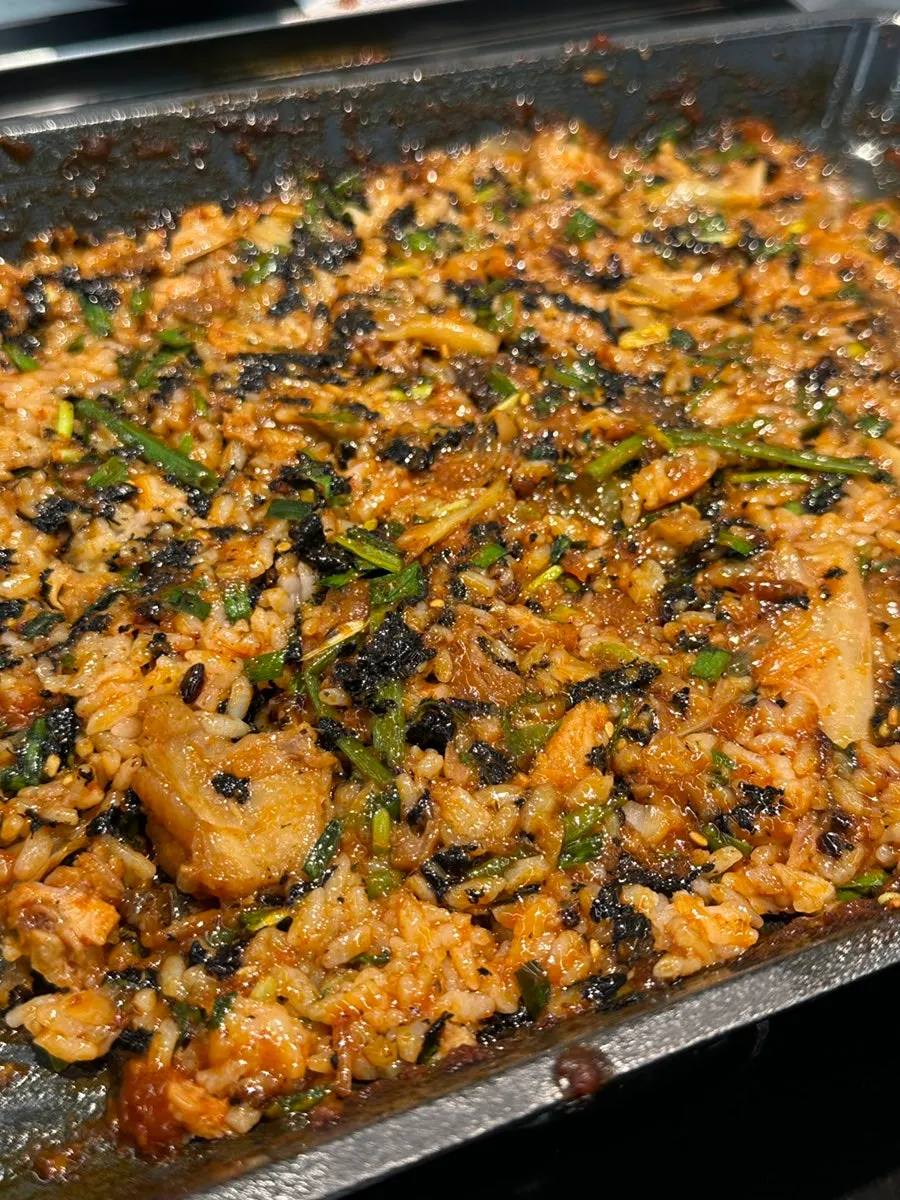 Fried rice topped with roasted seaweed flakes and flying fish roe