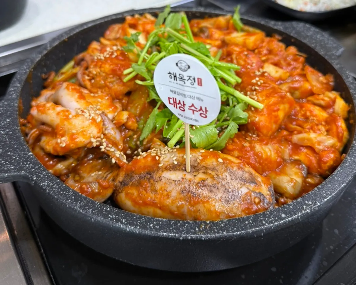 A full pot of the small seafood stew packed with seafood