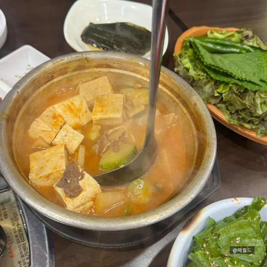 Complimentary doenjang jjigae served in a giant pot
