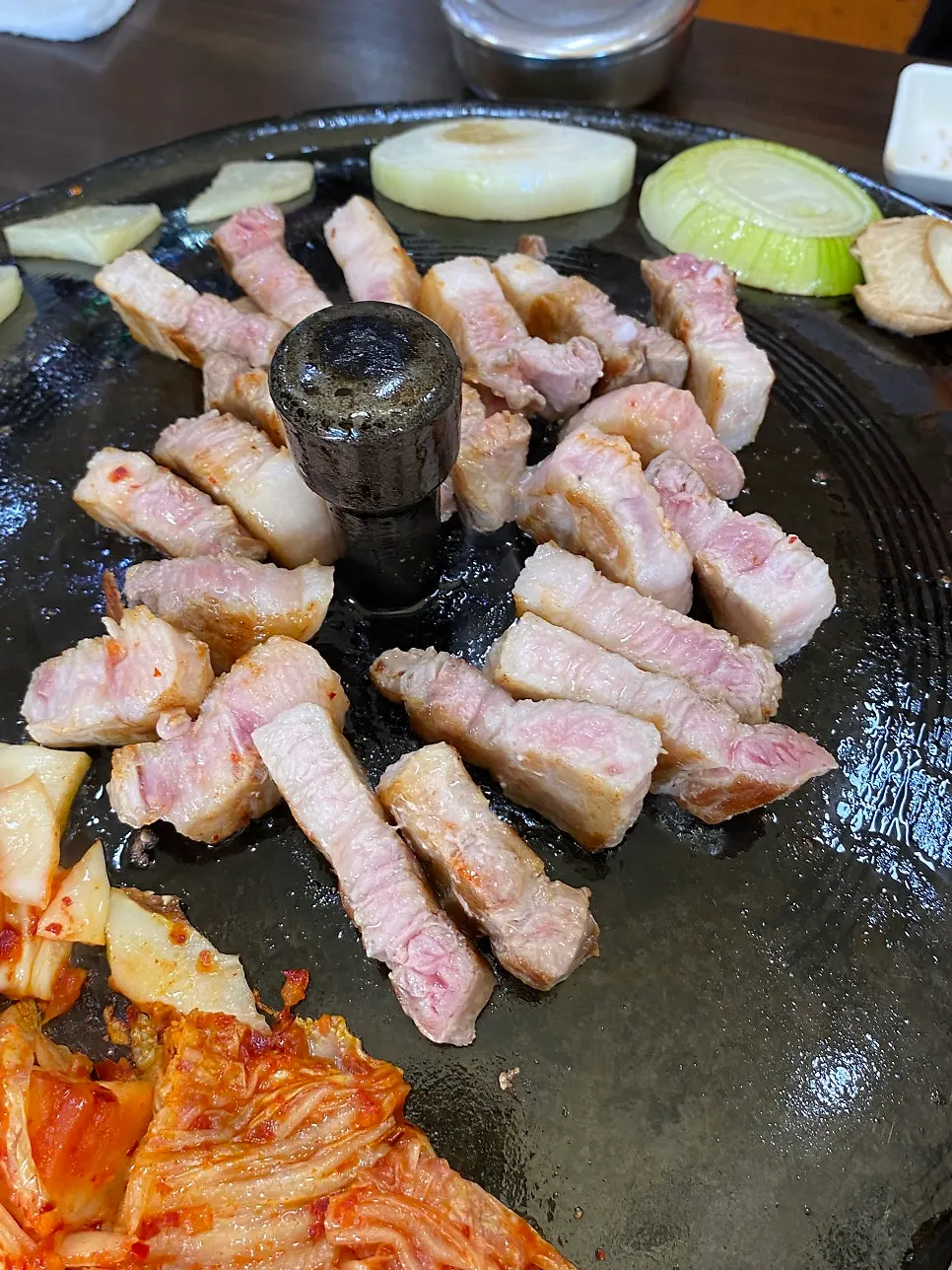 Kimchi grilling in pork fat