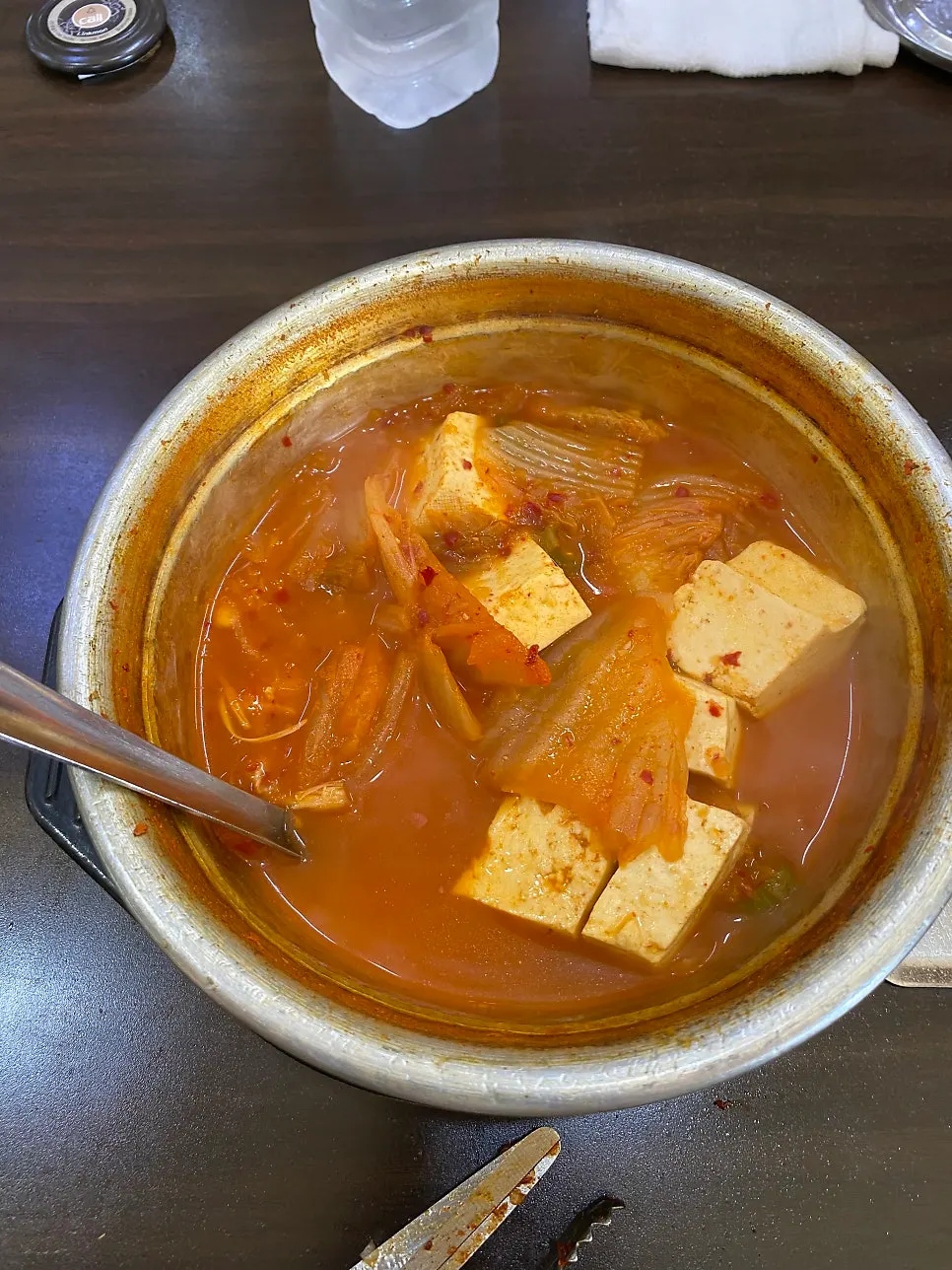 A bite combining naengmyeon and pork belly