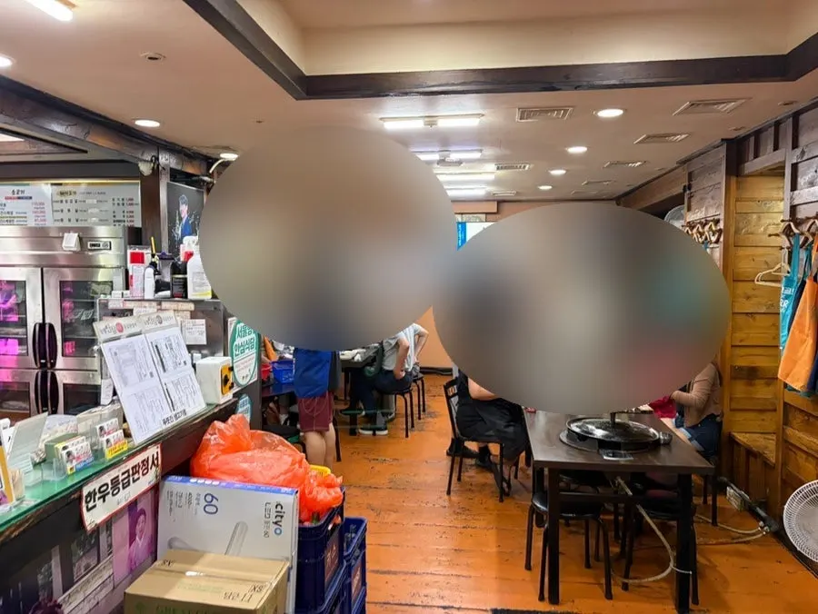 Interior dining hall of Pujutgan Saenggogi-jeom crowded with customers