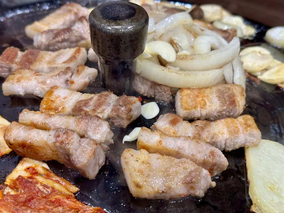 A golden-brown grilled piece of pork belly