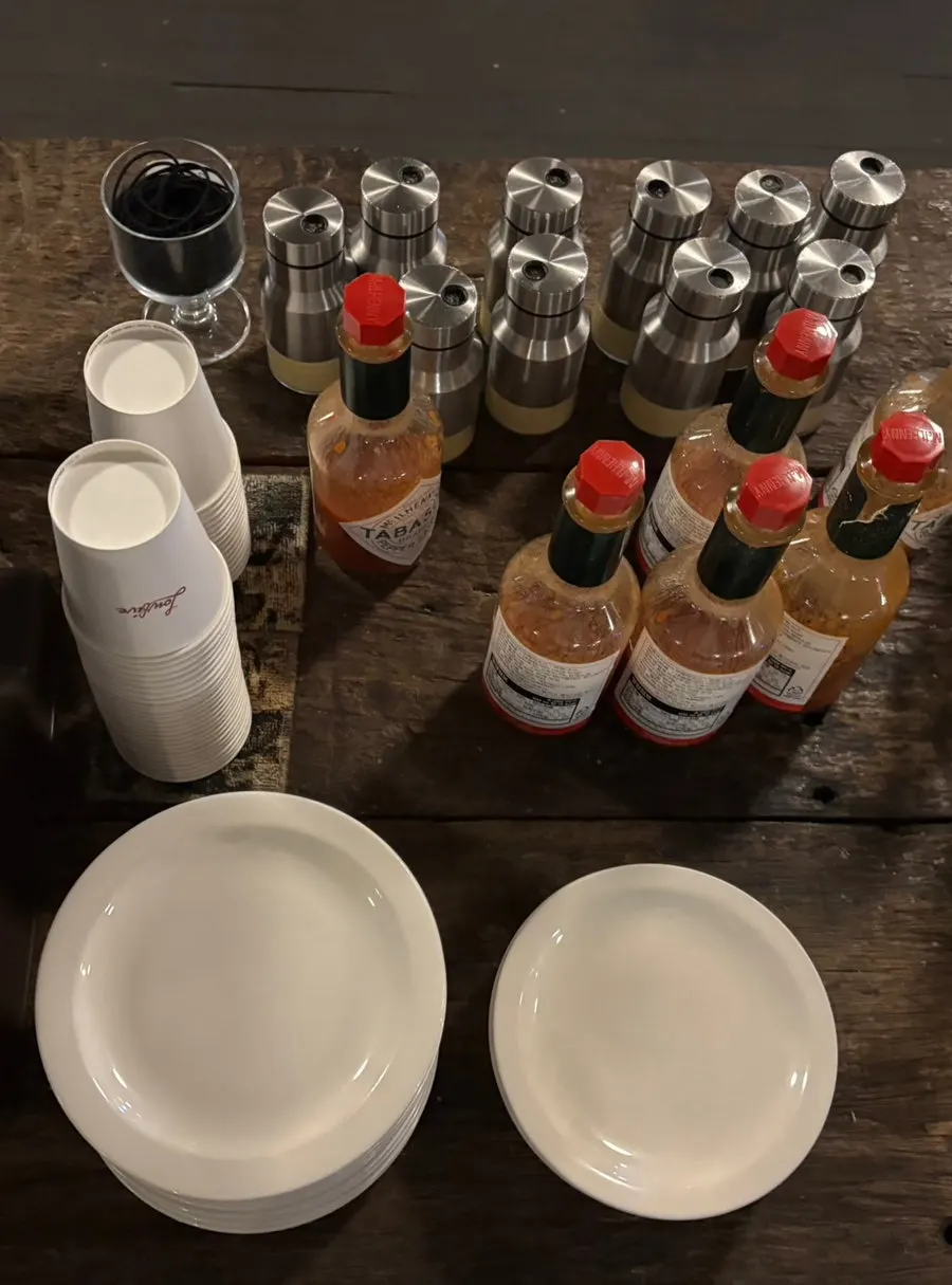 Self-serve cutlery zone with knives, chopsticks, and wet wipes