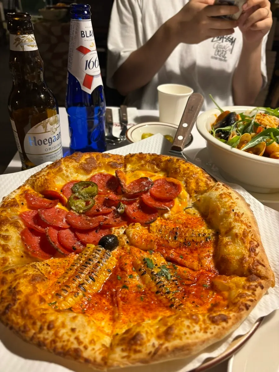 Half-and-half pizza with corn pizza and hot pepperoni