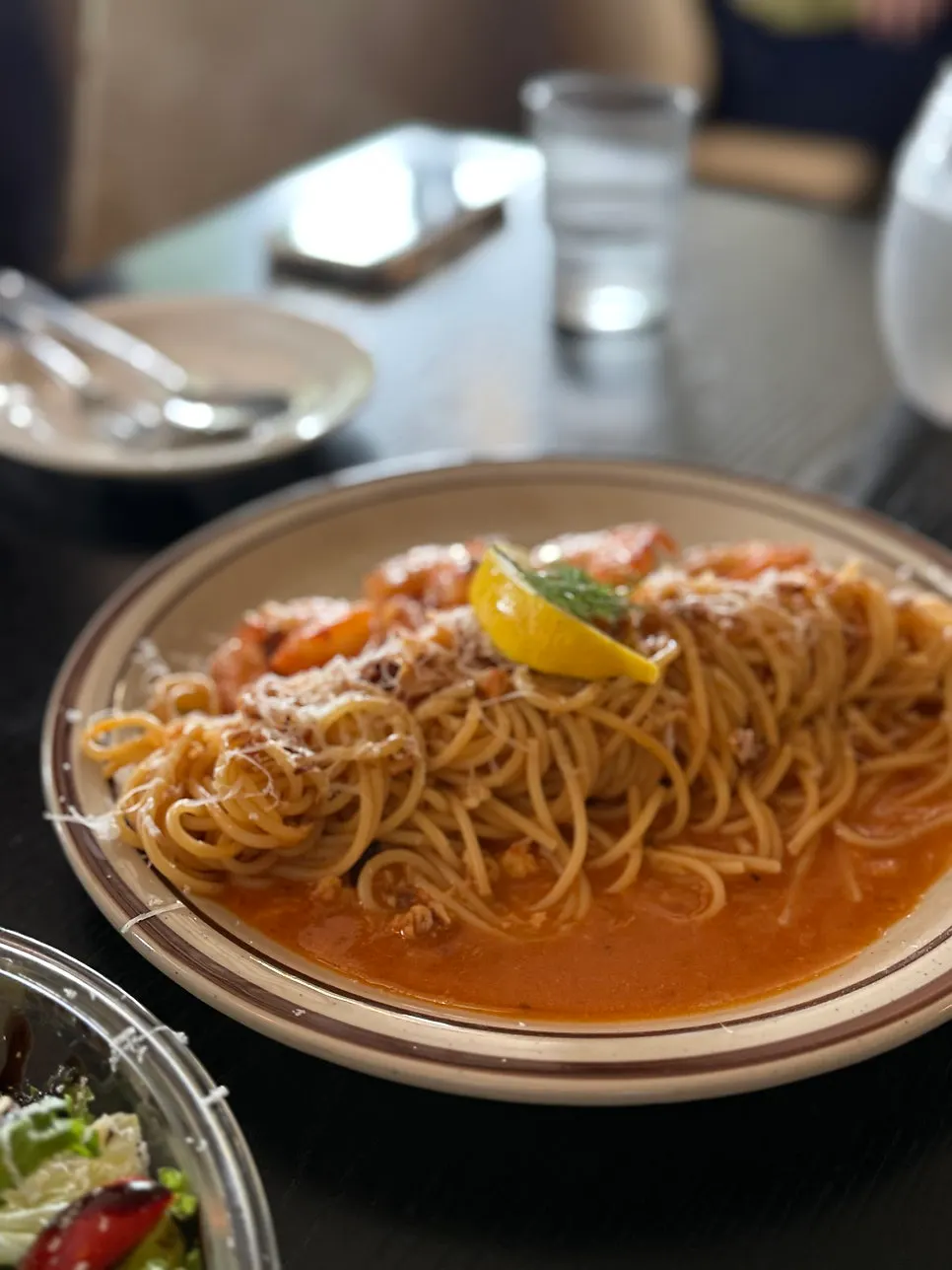 Close-up of plump shrimp on the rosé pasta