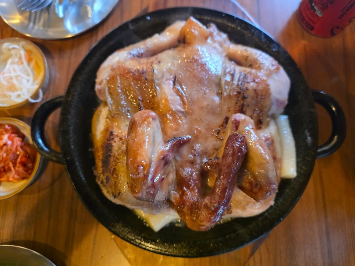 Sizzling hanbang jangjak tongdak on the hot plate