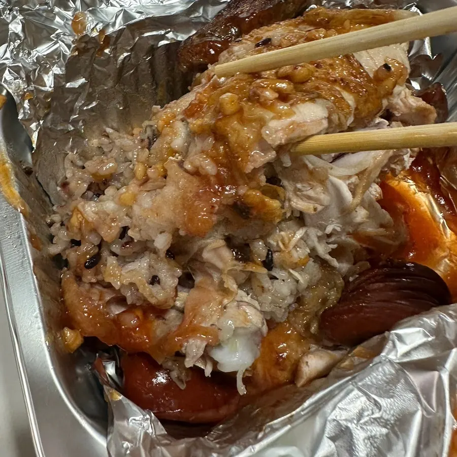 Seasoned roast chicken with added sausage on top