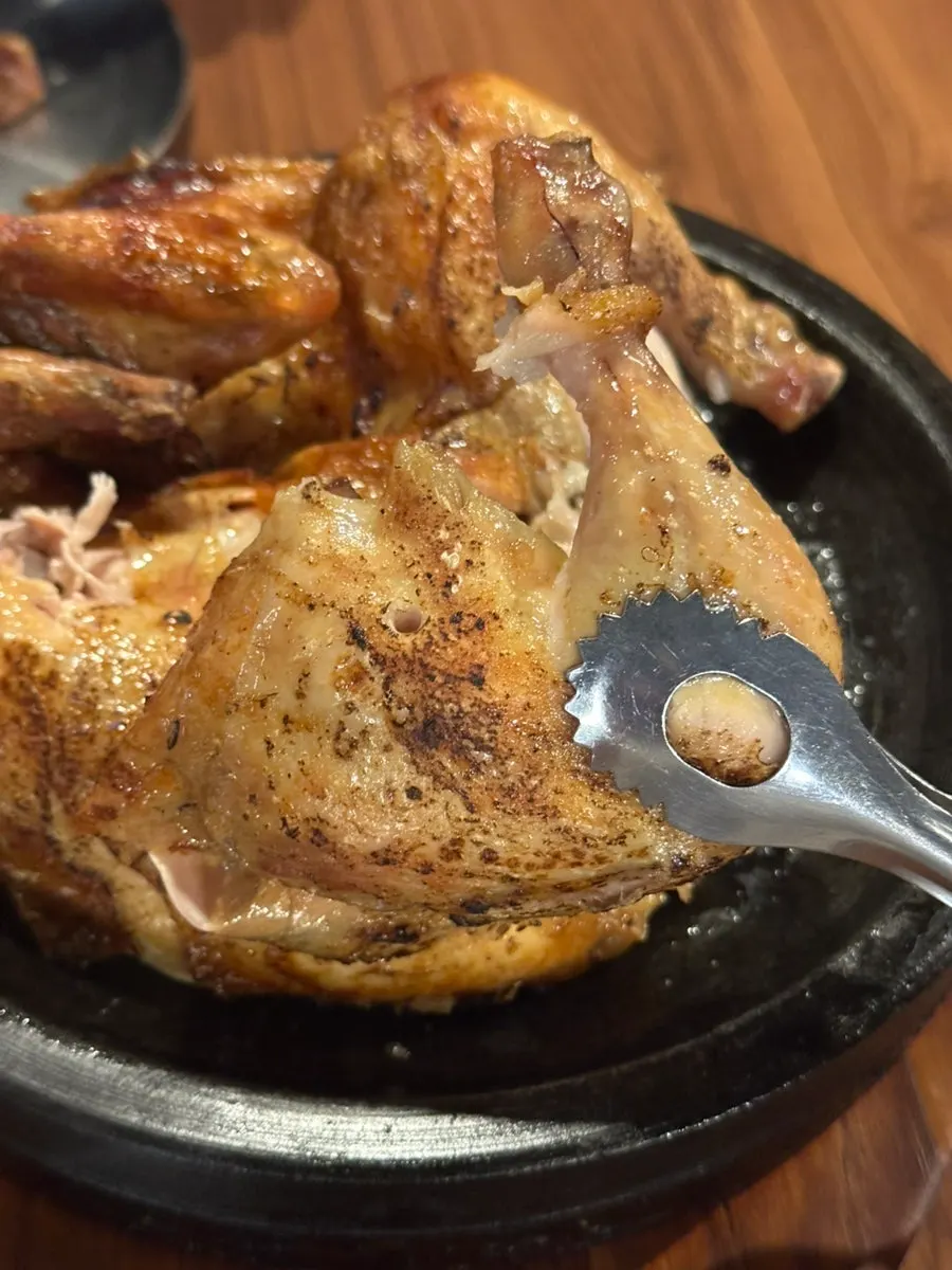 Crispy-outside, juicy-inside meat of the oak-fired chicken