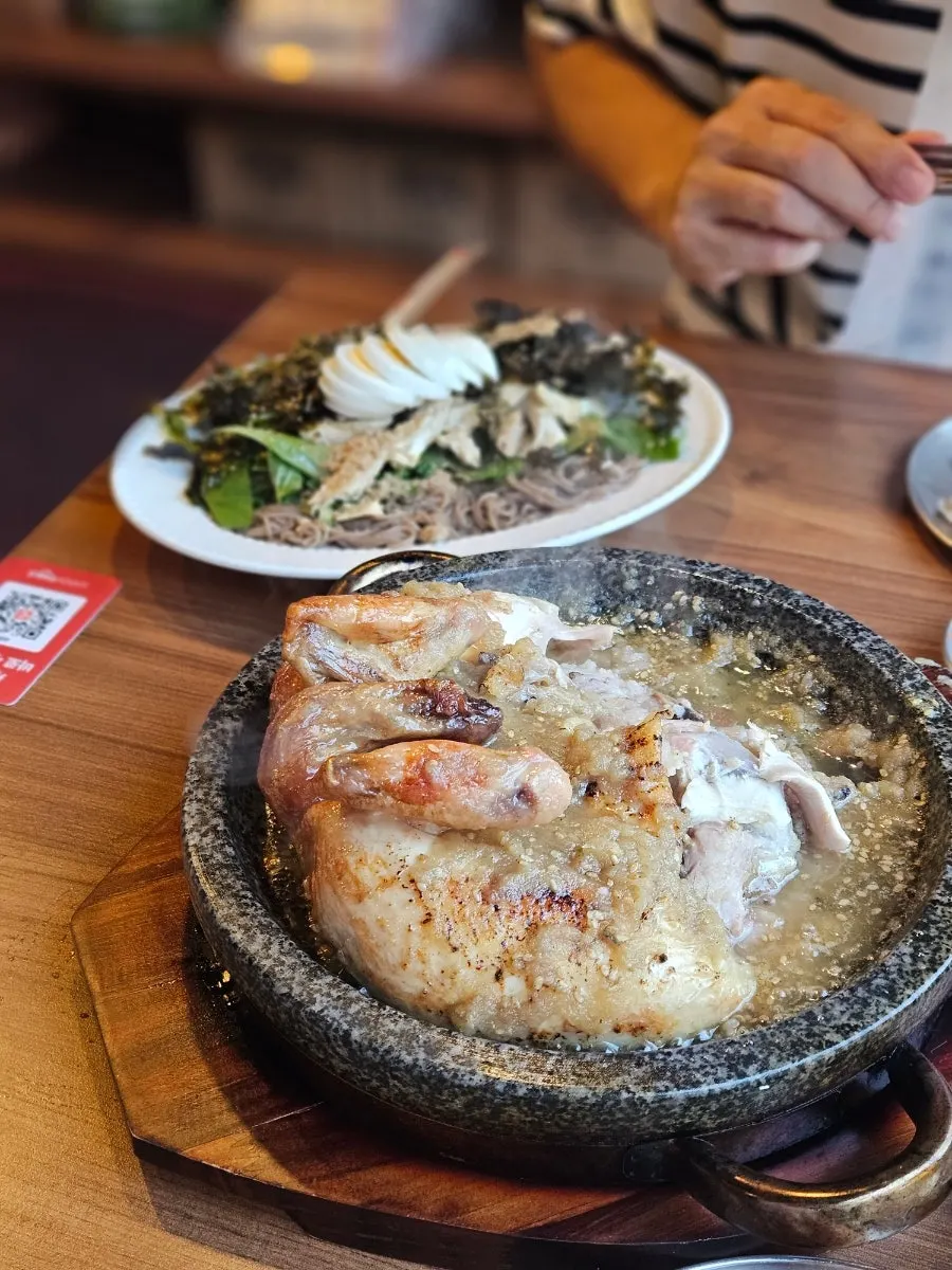 Chicken and wang-galbi sauce on the hot stone plate