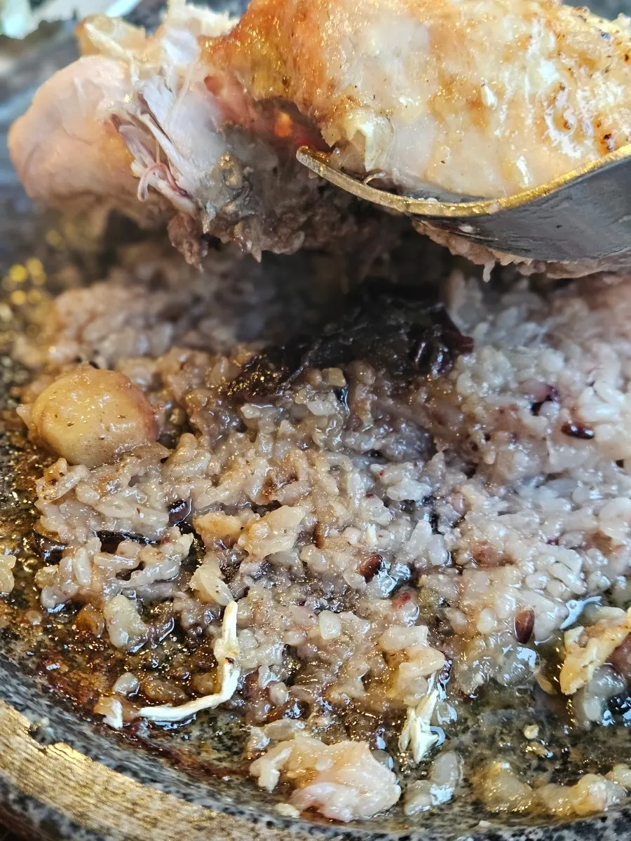Scorched rice (nurungji) underneath the chicken