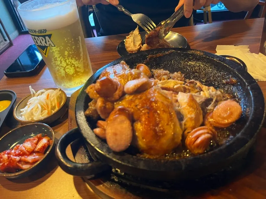 Oak-fired chicken served with cold draft beer