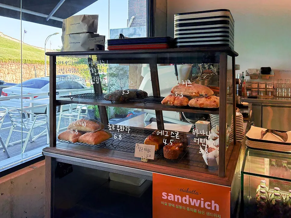 Bakery display case with ciabatta and sandwiches