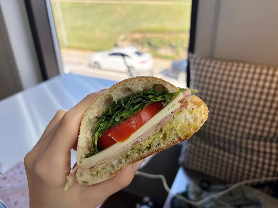 Sandwich filling showing arugula and tomato