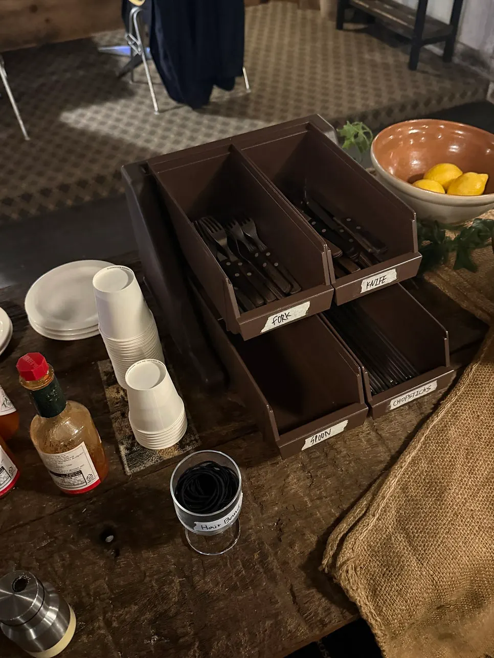 Napkins, extra plates and cups at the self bar