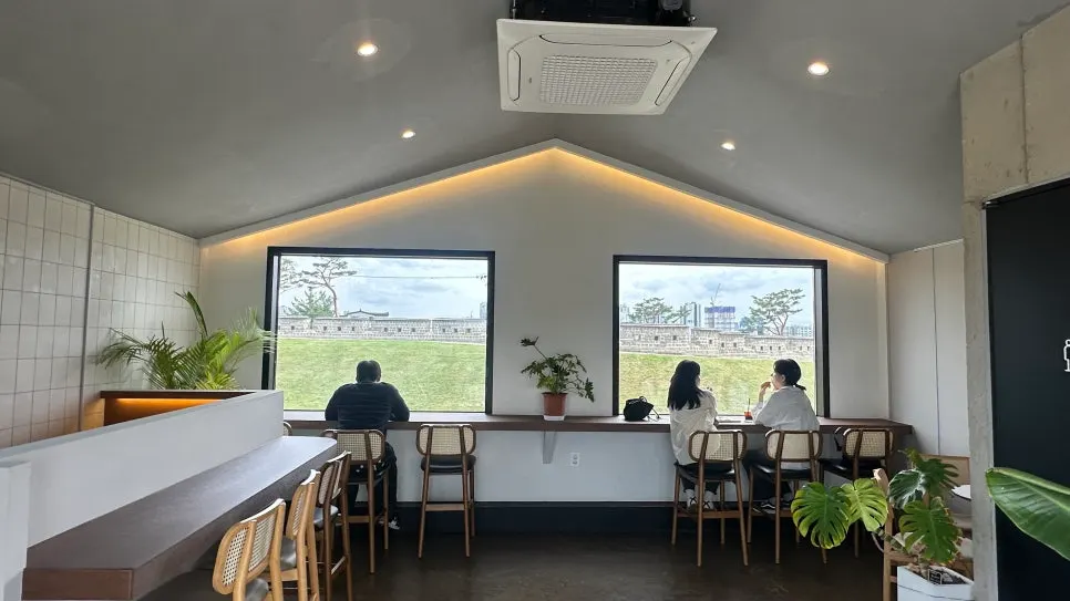 2nd-floor glass block corridor with silver mirror frames