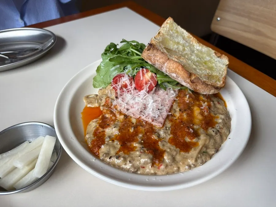 A plate of truffle white ragu open toast