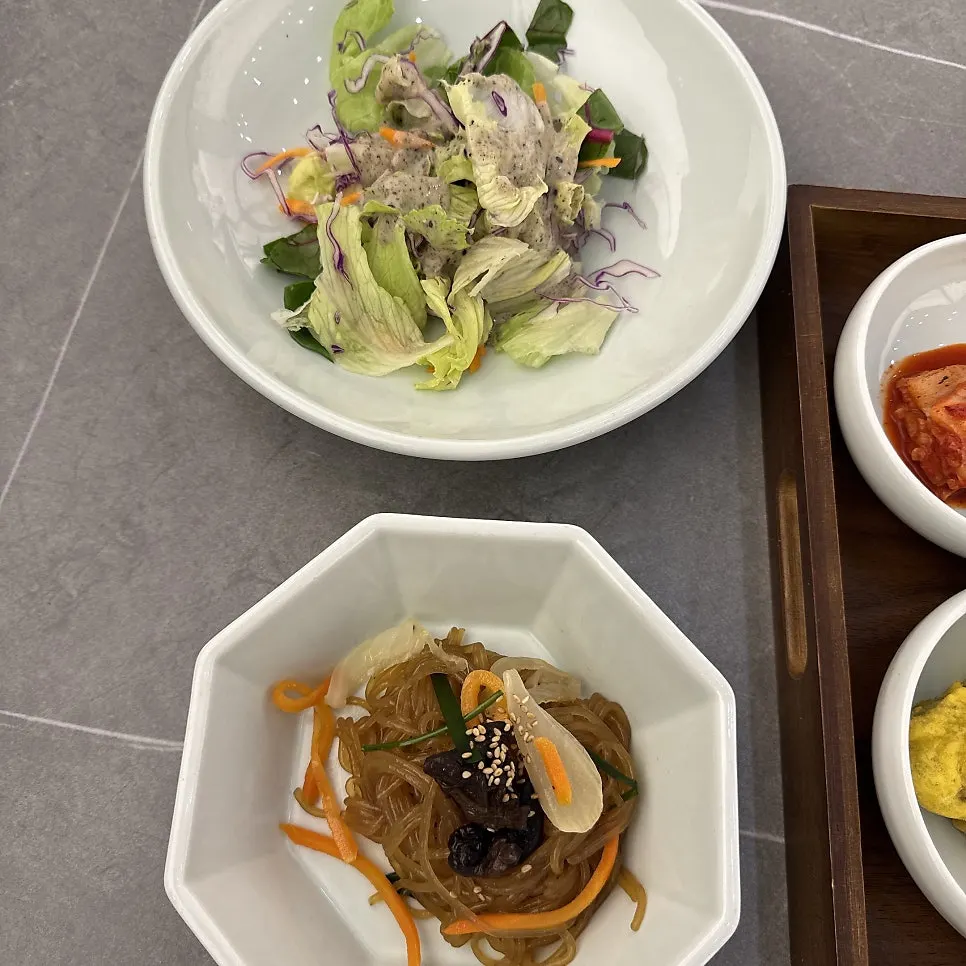 Fried eggplant and japchae among the side dishes
