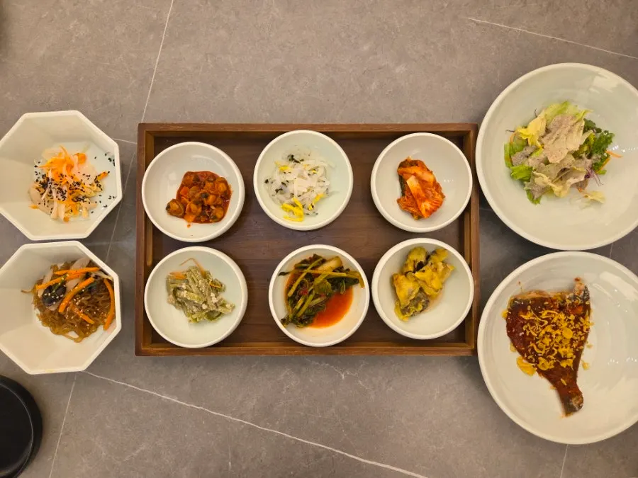 Neatly arranged basic banchan served first