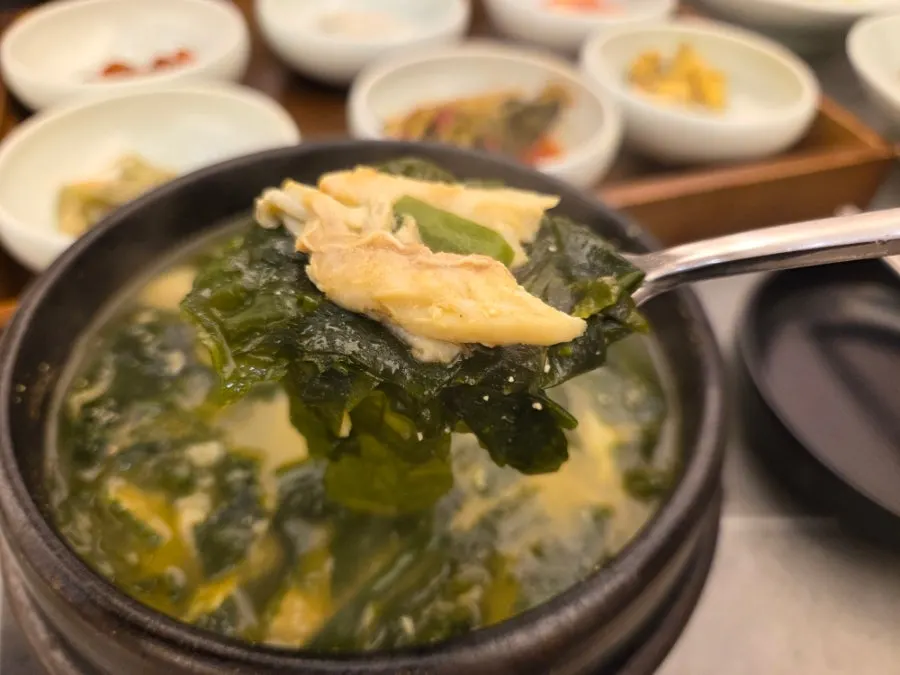 A spoonful of the rich seaweed soup broth