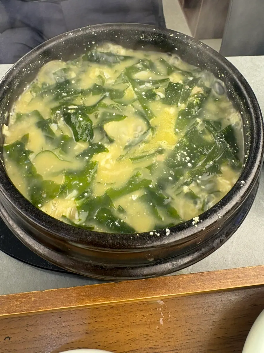 Table setting with seasoned-greens rice and seaweed soup