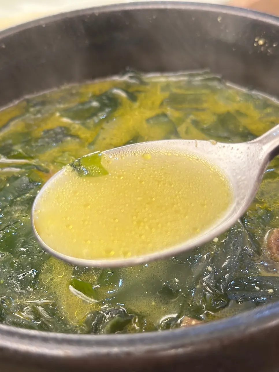 Comparing the broth colors of the flounder and beef seaweed soups