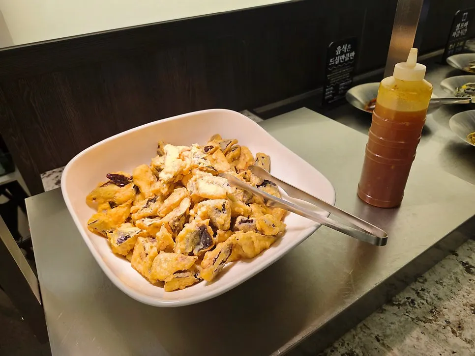 Seasoned vegetable side dishes taken from the self-serve bar