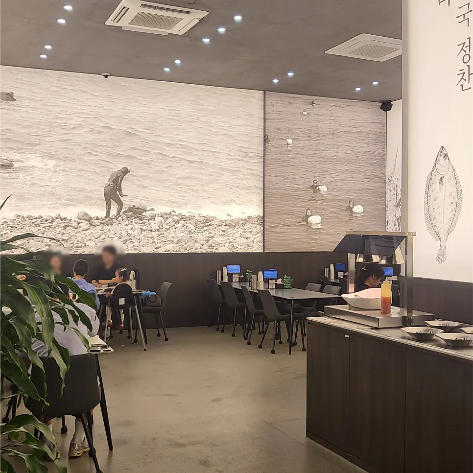 High-ceilinged gray-toned interior of Haenon Miyeok