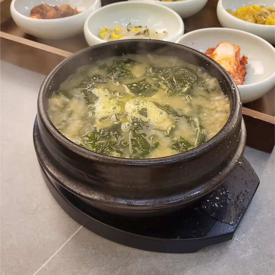 Bowls of banchan arranged at the self-serve bar
