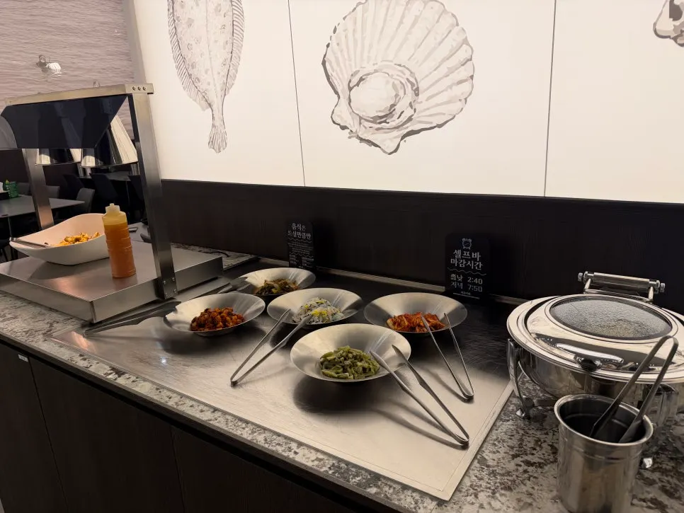 Self-serve banchan bar with japchae and fried eggplant