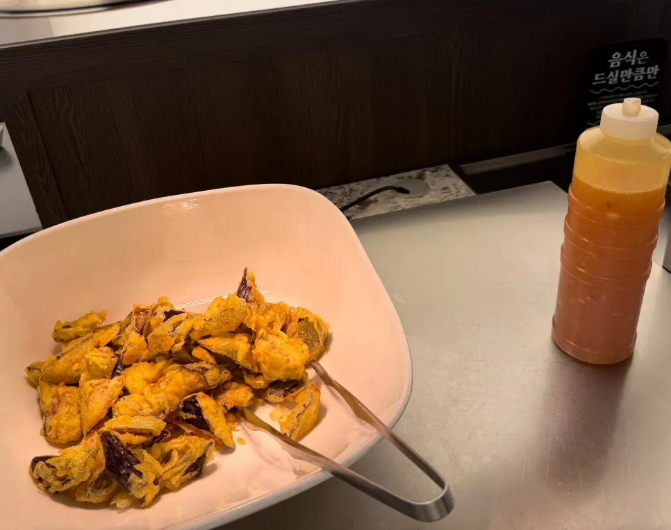 Neatly arranged side dishes at the self-serve bar on a weekday evening