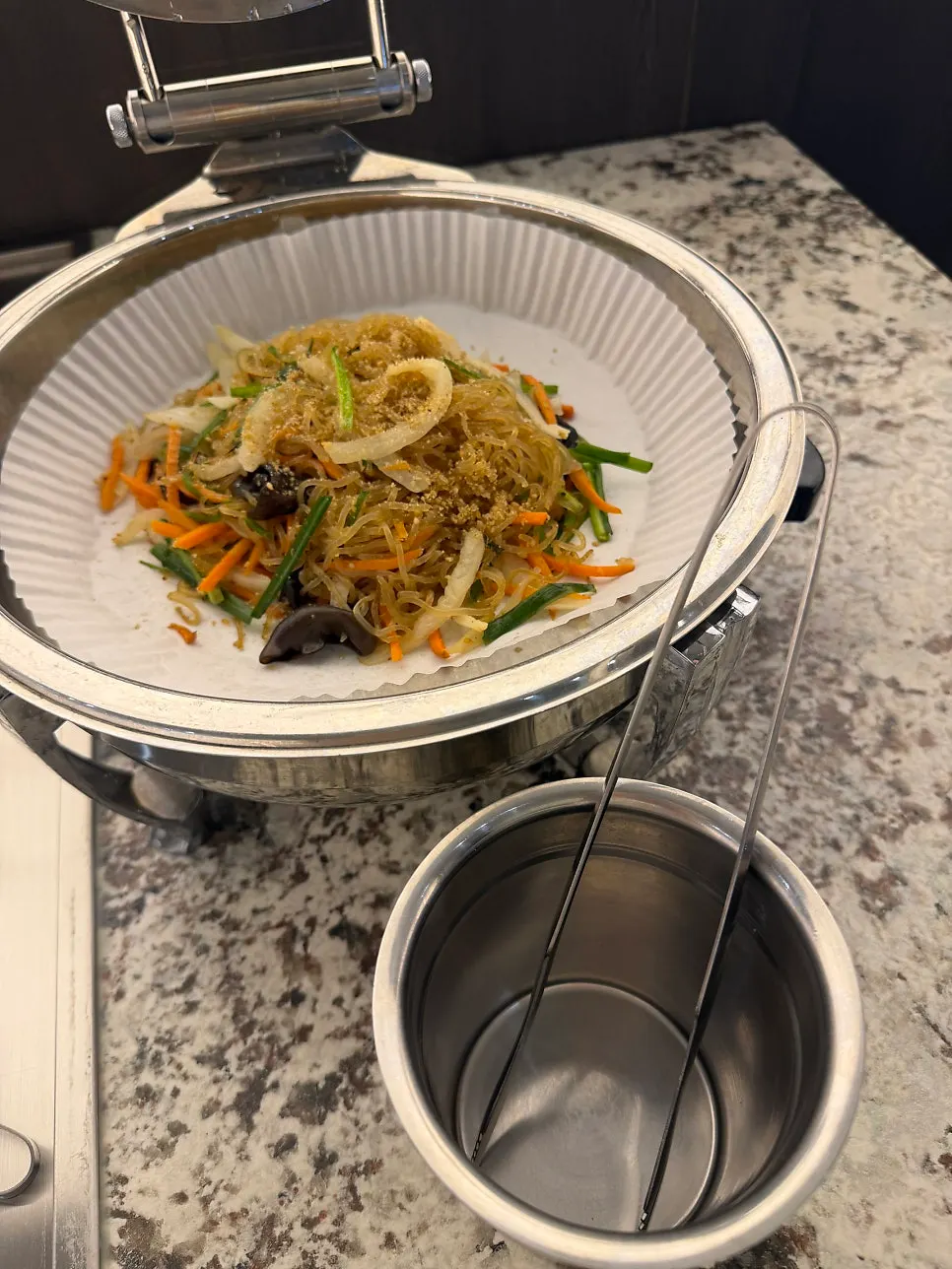 Side dish containers set out at the self-serve bar