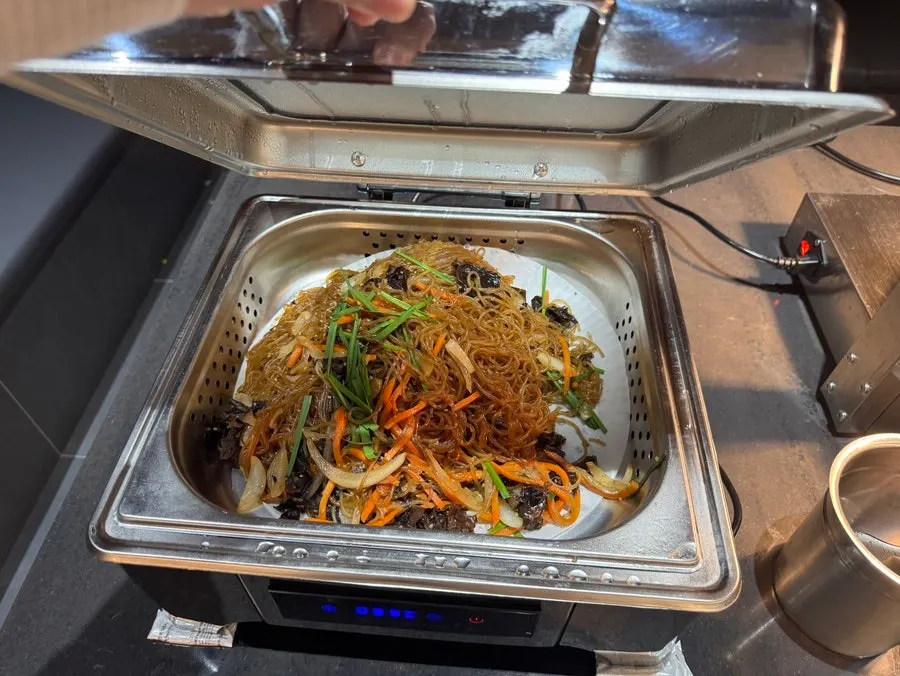 A plate of side dishes brought from the self-serve bar