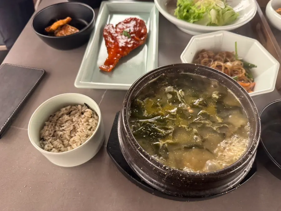 Bubbling seaweed soup served in an earthenware pot